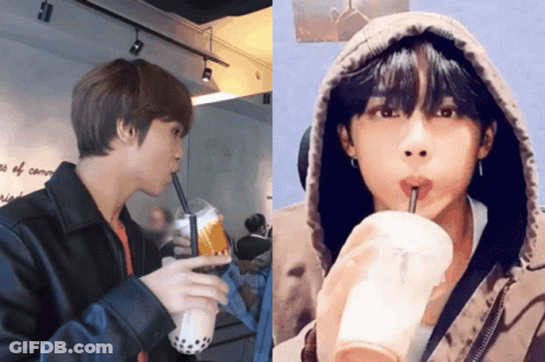 Two Men Drinking From Striped Cups GIF