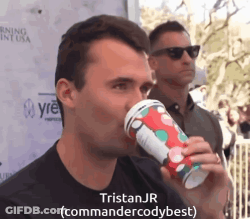 A Man Drinking From A Cup With The Name Tristan Jr Written On It GIF