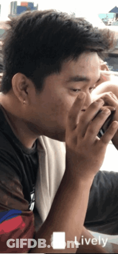 A Man Drinking From A Cup With The Word Lively On The Bottom Left GIF