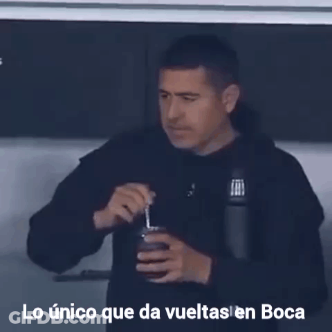 A Man Drinking From A Cup With The Words Lo Unico Que Da Vueltas En Boca Written Below Him GIF