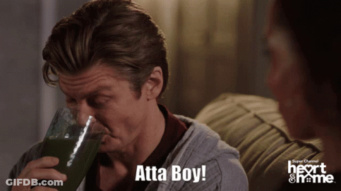 A Man Drinking From A Glass With The Words Atta Boy Written Below Him GIF