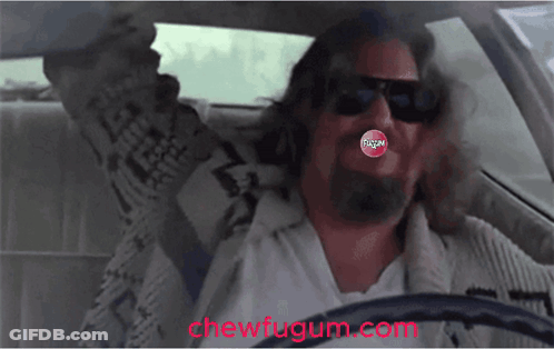 A Man Driving A Car With A Chew Fugum In His Mouth GIF