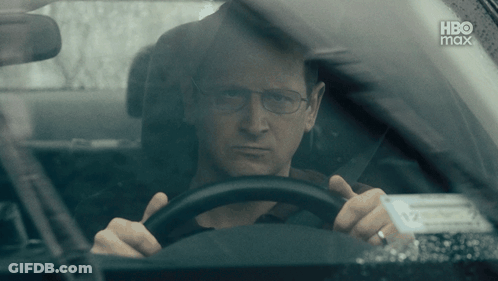 A Man Driving A Car With A Hbo Max Logo On The Bottom GIF