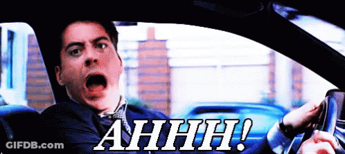 A Man Driving A Car With His Mouth Open And The Words Ahhh Written On The Bottom GIF