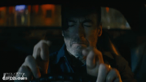A Man Driving A Car With The Word Nobody On The Bottom GIF