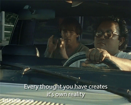 A Man Driving A Car With The Words " Every Thought You Have Creates It 'S Own Reality " Written On The Windshield GIF