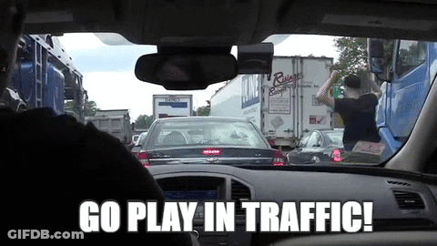 A Man Driving A Car With The Words Go Play In Traffic GIF