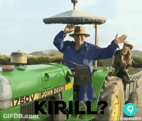 A Man Driving A John Deere Tractor With The Words " Kirill " On The Front GIF