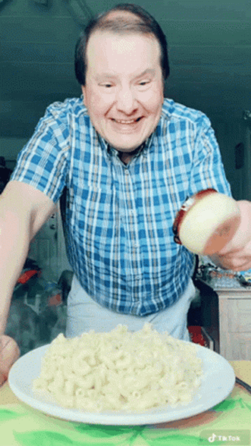 A Man Enjoying His Mac N Cheese GIF