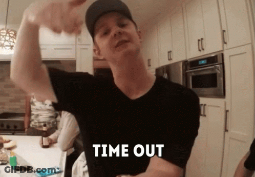 A Man Flexing His Muscles In A Kitchen With The Words Time Out Written On His Chest GIF