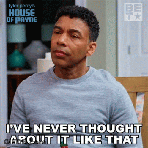 A Man From Tyler Perry 'S House Of Payne Sits In A Chair GIF