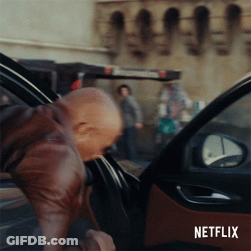 A Man Getting Out Of A Car With A Netflix Logo On The Bottom GIF