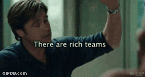 A Man Giving A High Five With The Words There Are Rich Teams GIF
