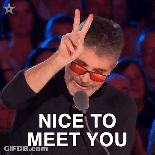 A Man Giving A Peace Sign In Front Of A Crowd With The Words Nice To Meet You Below Him GIF
