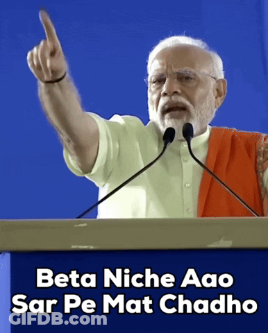 A Man Giving A Speech With The Words Beta Niche Aao Sar Pe Mat Chado Below Him GIF