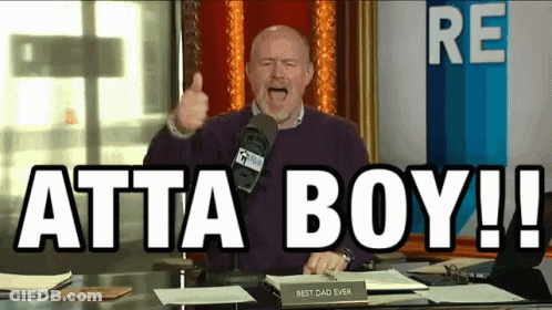 A Man Giving A Thumbs Up In Front Of A Microphone With The Words Atta Boy Written On The Screen GIF