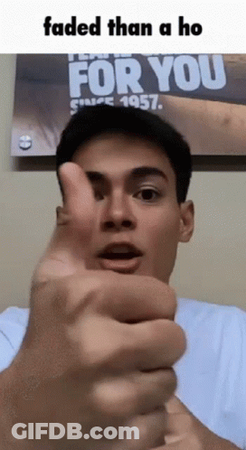 A Man Giving A Thumbs Up In Front Of A Poster That Says For You GIF