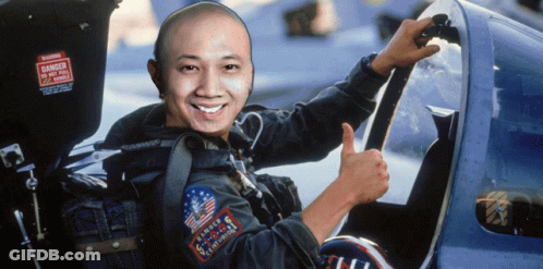 A Man Giving A Thumbs Up In Front Of A Sign That Says Danger Do Not Pull Handles GIF