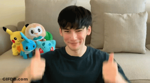 A Man Giving A Thumbs Up In Front Of Stuffed Pokemon GIF