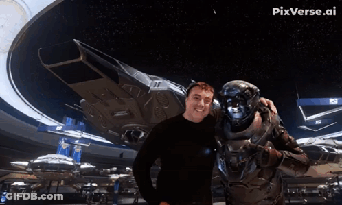 A Man Giving A Thumbs Up Next To A Robot With Pix Written On The Bottom GIF