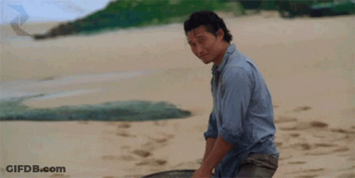 A Man Giving A Thumbs Up On A Beach GIF