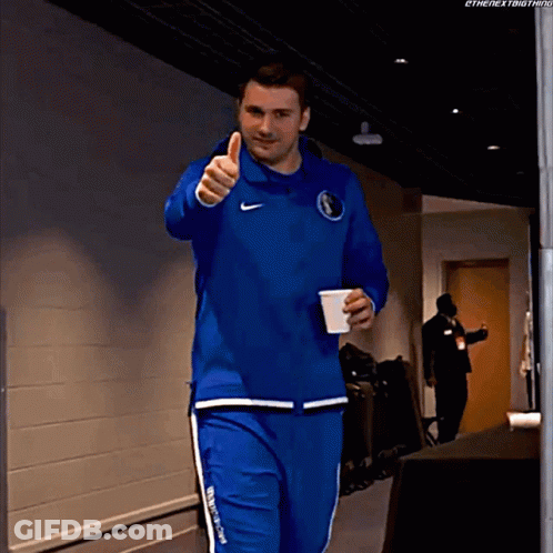 A Man Giving A Thumbs Up While Holding A Cup GIF