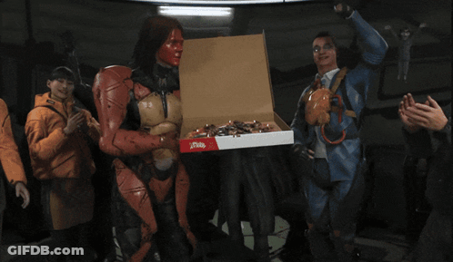 A Man Giving A Thumbs Up While Holding A Pizza Box GIF
