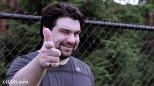 A Man Giving A Thumbs Up With A Champion Shirt On GIF