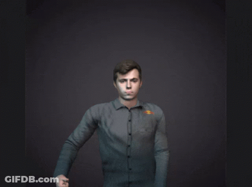 A Man Giving A Thumbs Up With The Letter Gg Behind Him GIF
