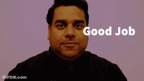 A Man Giving A Thumbs Up With The Words Good Job Behind Him GIF