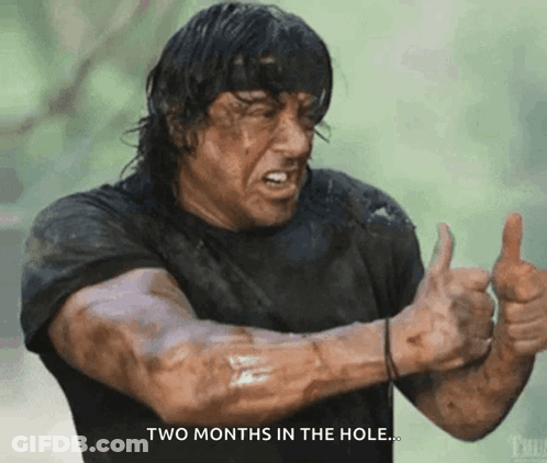 A Man Giving A Thumbs Up With The Words Two Months In The Hole Below Him GIF