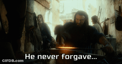 A Man Hammering A Piece Of Metal With The Words He Never Forgave GIF