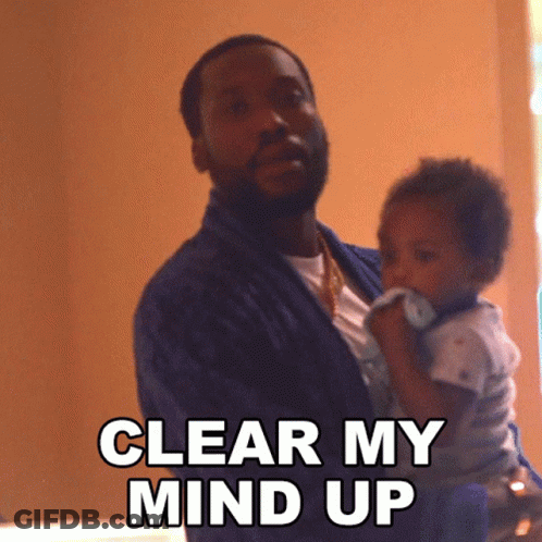 A Man Holding A Baby With The Words Clear My Mind Up GIF