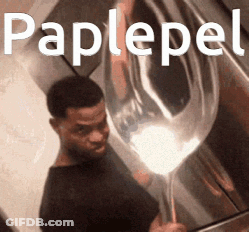 A Man Holding A Balloon With The Word Paplepel Written On It GIF