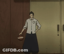 A Man Holding A Basketball In Front Of A Door GIF