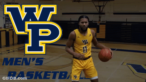 A Man Holding A Basketball In Front Of A Sign That Says Men 'S Basketball GIF