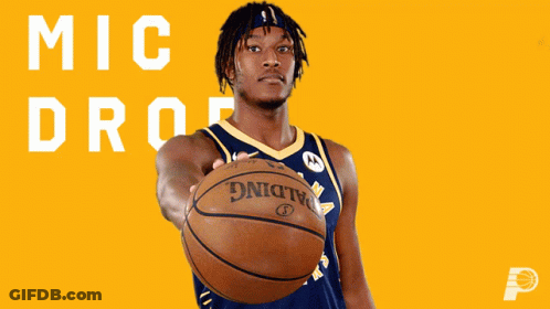 A Man Holding A Basketball In Front Of A Yellow Background That Says " Mic Drop " GIF