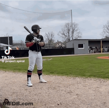 A Man Holding A Bat On A Baseball Field With A Tiktok Logo On The Bottom GIF