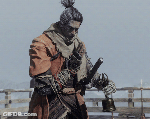 A Man Holding A Bell And A Sword In His Hands GIF