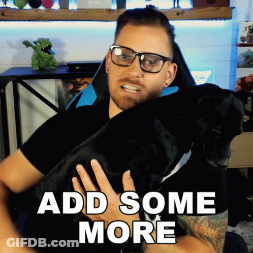 A Man Holding A Black Dog With The Words Add Some More GIF
