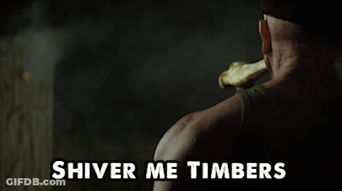 A Man Holding A Bone In His Mouth With The Words Shiver Me Timbers Below Him GIF
