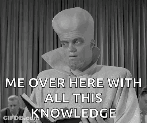 A Man Holding A Book With The Words Me Over Here With All This Knowledge GIF