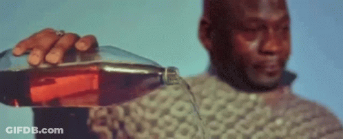 A Man Holding A Bottle Of Alcohol With A Bitcoin Symbol In The Background GIF