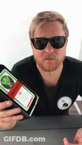A Man Holding A Bottle Of Jagermeister 50 GIF