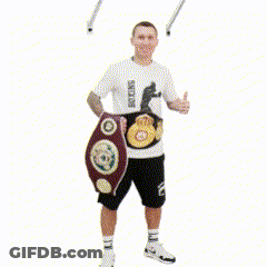 A Man Holding A Boxing Belt And Giving A Thumbs Up With The Word Ok Below Him GIF