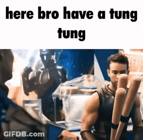 A Man Holding A Bunch Of Baseball Bats With The Words Here Bro Have A Tung Tung GIF