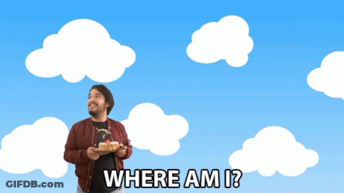 A Man Holding A Cake With The Words Where Am I GIF