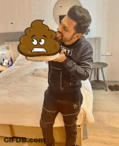 A Man Holding A Cartoon Drawing Of A Poop With A Sad Face GIF