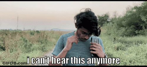 A Man Holding A Cell Phone With The Words " I Can 'T Hear This Anymore " On The Bottom GIF