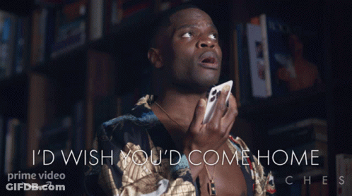 A Man Holding A Cell Phone With The Words " I 'D Wish You 'D Come Home " Below Him GIF